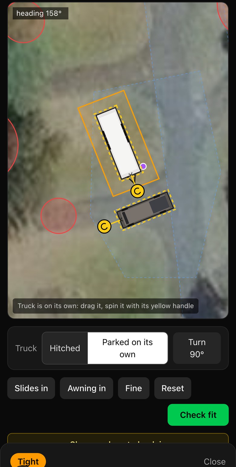 Fit Check with the truck unhitched and turned sideways behind the trailer on a Fort Stevens campsite